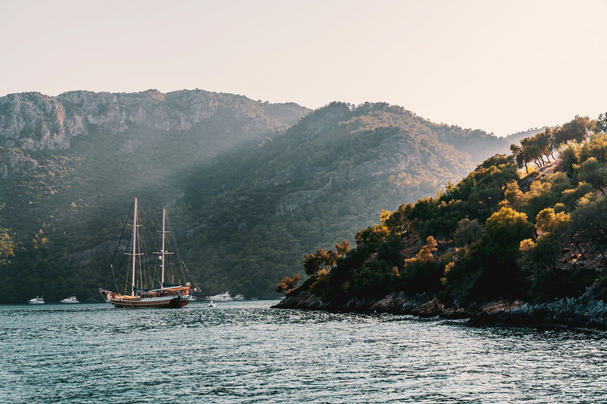 A coastline with ships sailing nearby