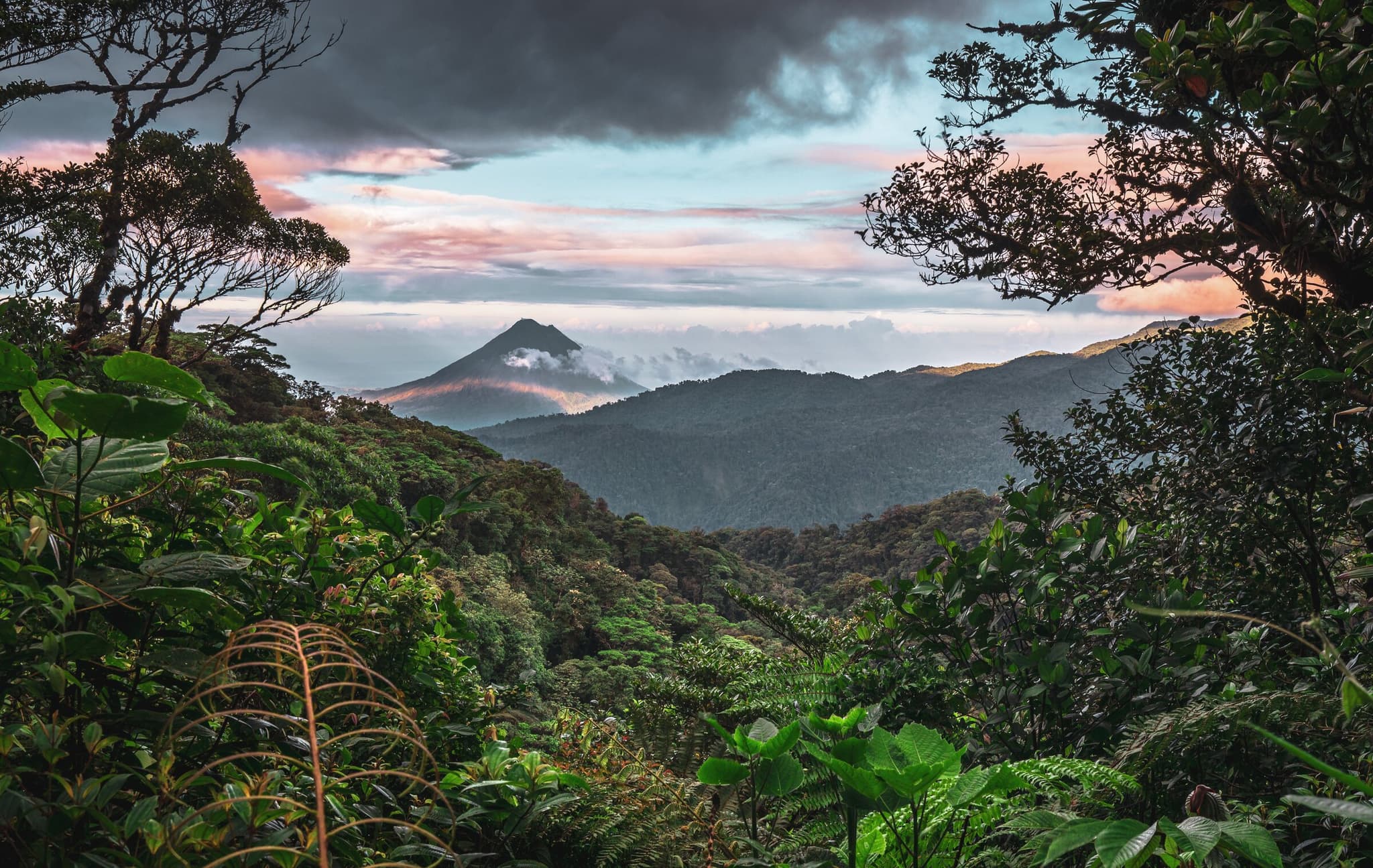 Arenal Volcano rising above lush rainforest on a luxury Costa Rica tour