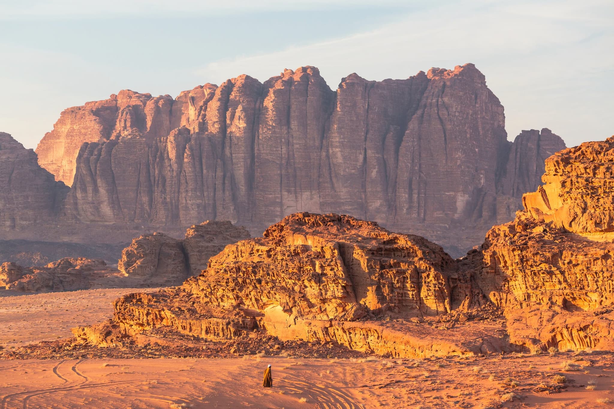 Red sandstone desert of Wadi Rum glowing at sunset on a Jordan luxury tour