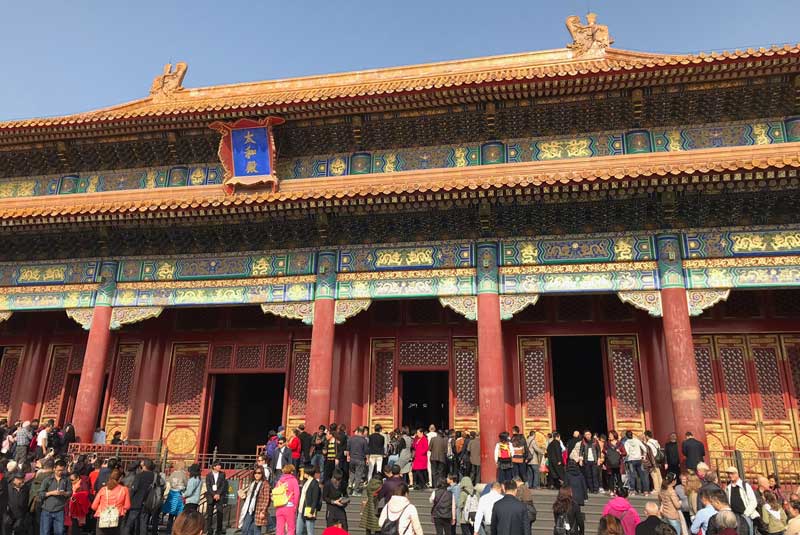 Crowded square in the Forbidden City, Beijing China with Geoex.
