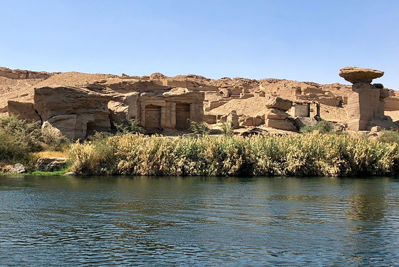 The Noble Tombs seen from a boat on the Nile River, Egypt