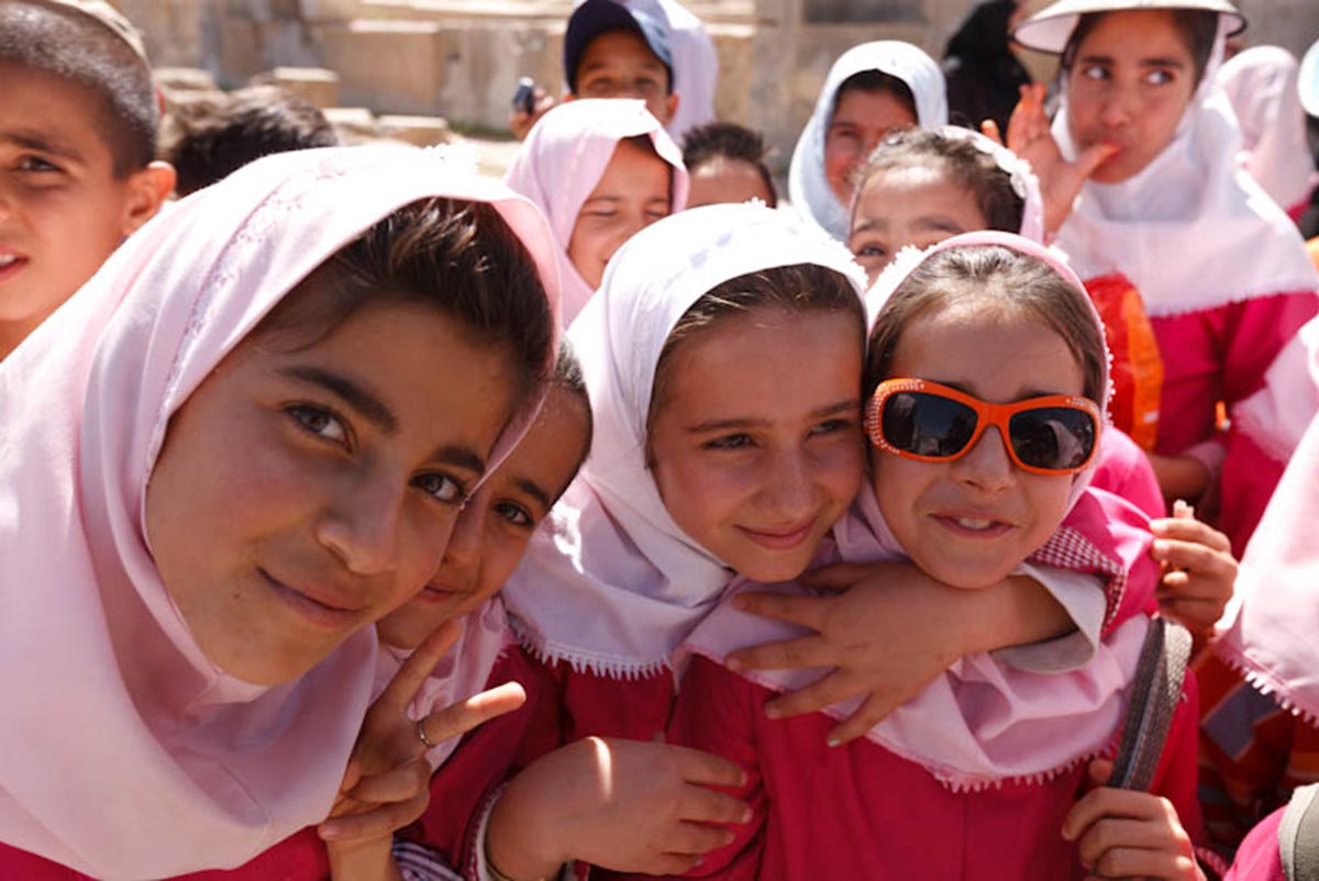 Girls dressed in pink head scarves at Persepolis, Shiraz, Iran.