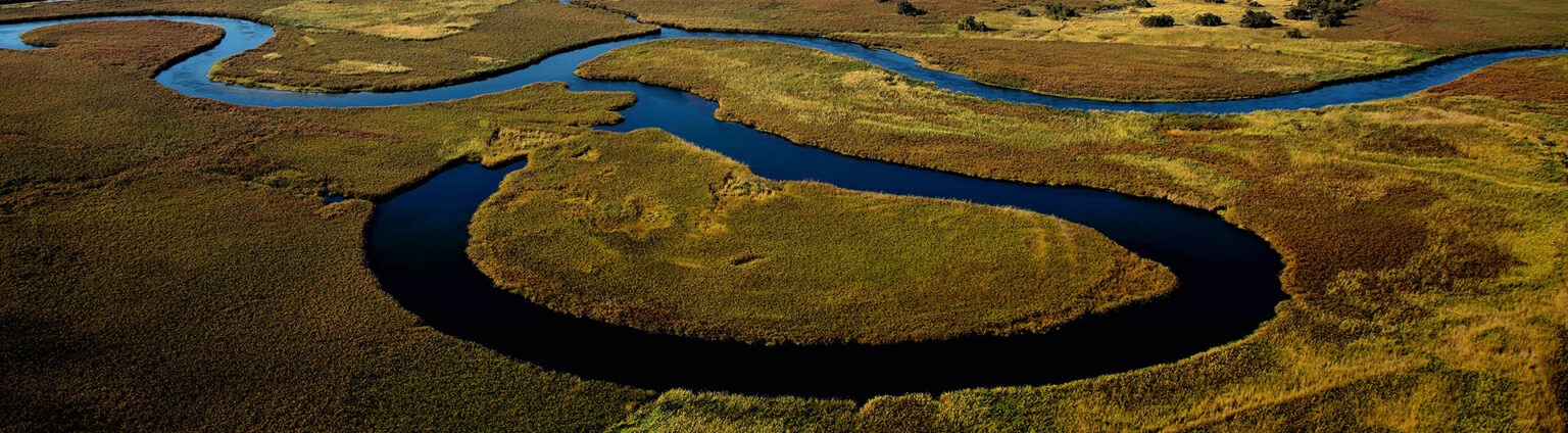 2024 Travel Small Group Trips And Tours GeoEx   Botswana Okavango River Aerial 1536x424 