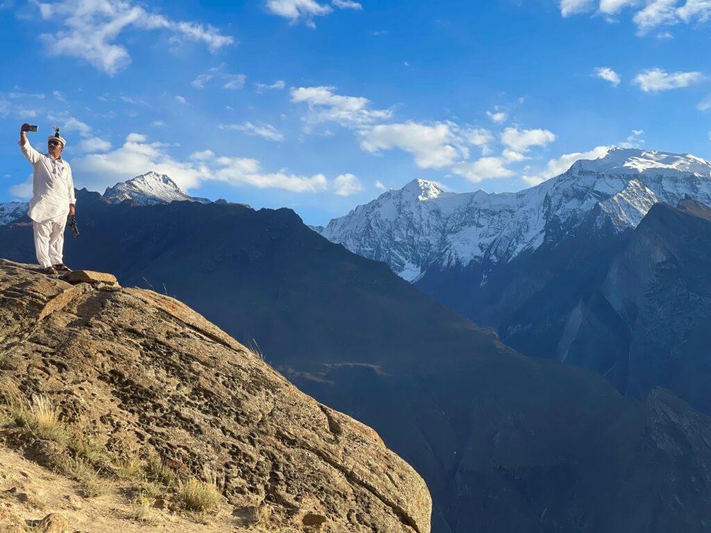 Travel Photo: Man taking a selfie in the Karakoram mountains in Pakistan.